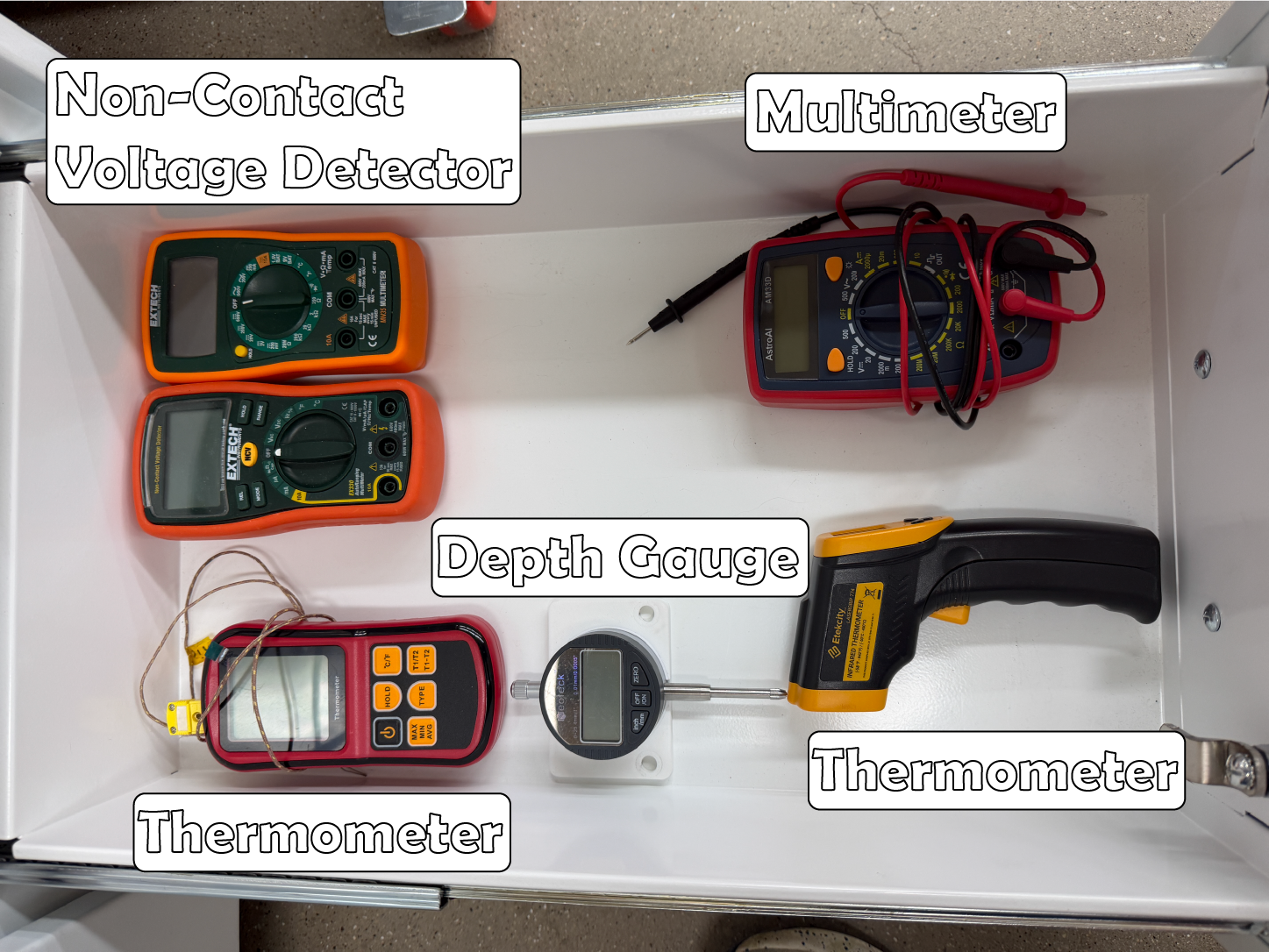 Measurement Devices: There is a drawer located near the electrical station that holds various measuring devices such as thermometers, a multi-meter, and voltage detectors.